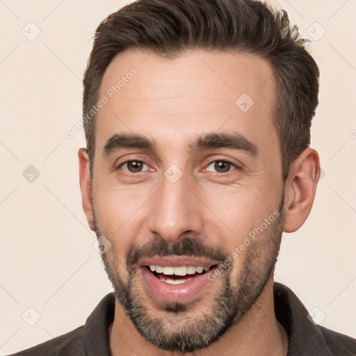 Joyful white young-adult male with short  brown hair and brown eyes