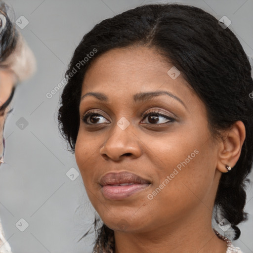 Joyful black young-adult female with medium  black hair and brown eyes