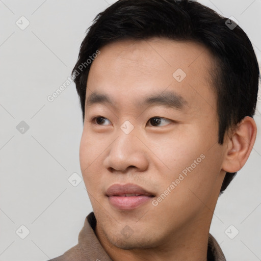 Neutral asian young-adult male with short  black hair and brown eyes