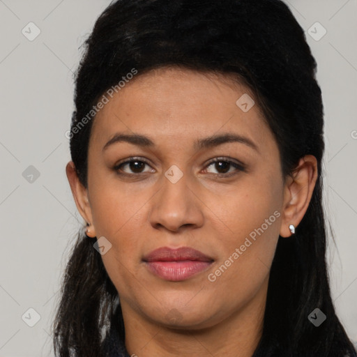 Joyful latino young-adult female with long  brown hair and brown eyes