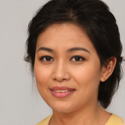 Joyful white young-adult female with medium  brown hair and brown eyes