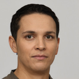 Neutral white young-adult male with short  black hair and brown eyes