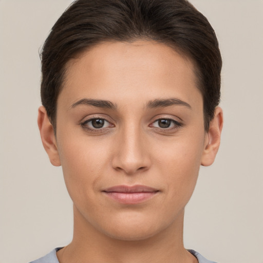 Joyful white young-adult female with short  brown hair and brown eyes