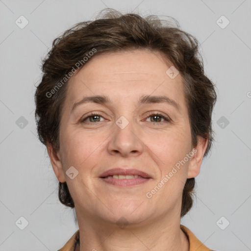 Joyful white adult female with short  brown hair and brown eyes