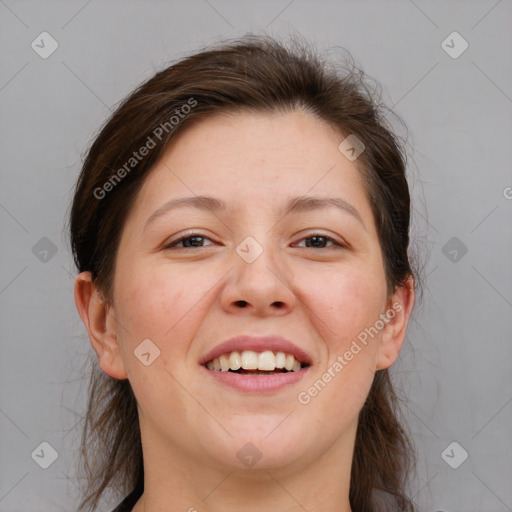 Joyful white adult female with medium  brown hair and grey eyes