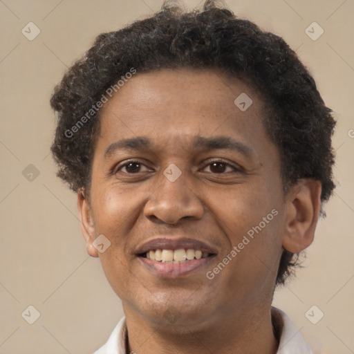 Joyful latino adult male with short  brown hair and brown eyes