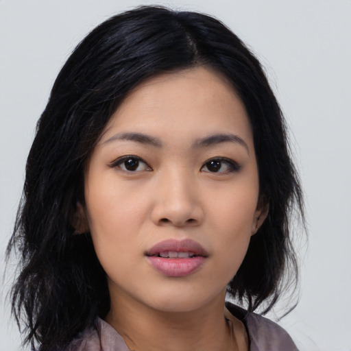 Neutral asian young-adult female with medium  black hair and brown eyes