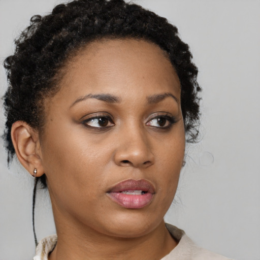 Neutral black young-adult female with short  brown hair and brown eyes