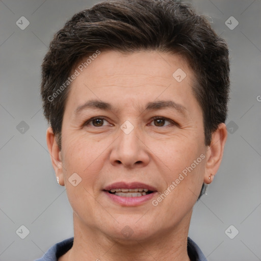 Joyful white adult female with short  brown hair and brown eyes