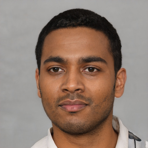 Neutral latino young-adult male with short  black hair and brown eyes