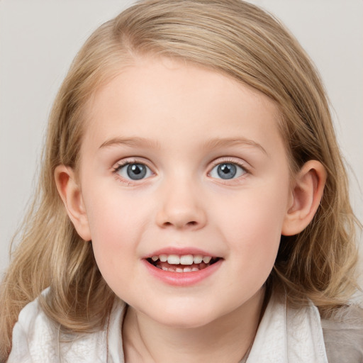 Joyful white child female with medium  brown hair and blue eyes