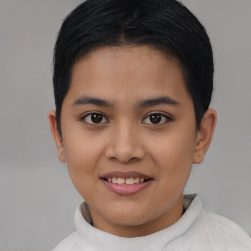 Joyful asian child female with short  black hair and brown eyes
