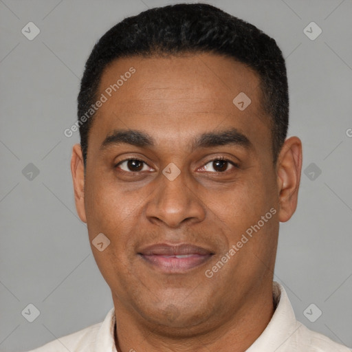 Joyful latino adult male with short  black hair and brown eyes