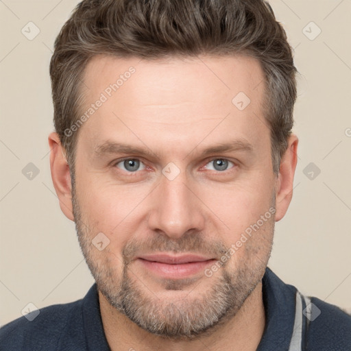 Joyful white adult male with short  brown hair and grey eyes