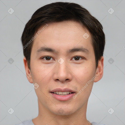 Joyful asian young-adult male with short  brown hair and brown eyes