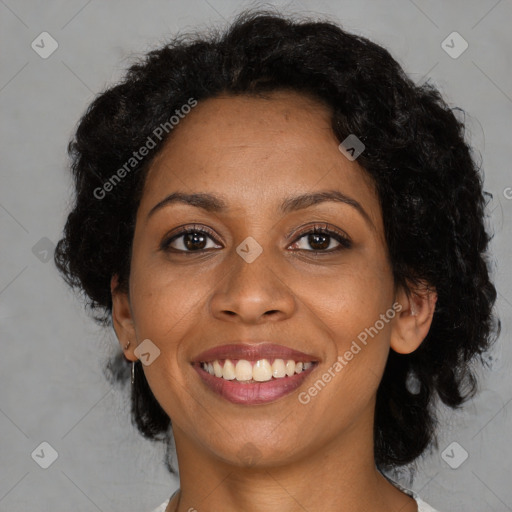 Joyful black young-adult female with medium  brown hair and brown eyes