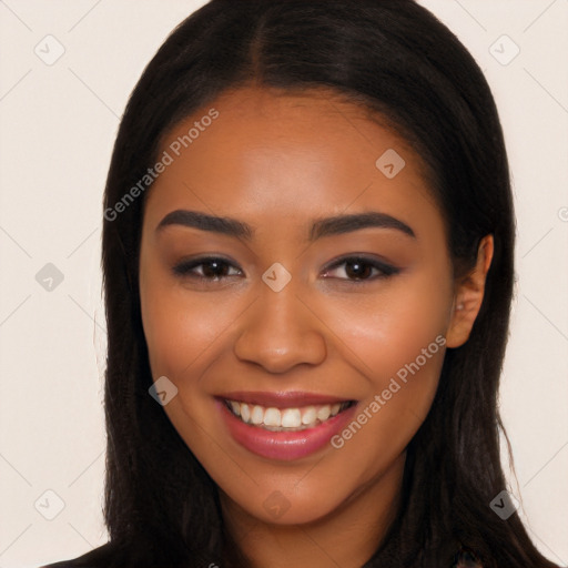 Joyful latino young-adult female with long  brown hair and brown eyes