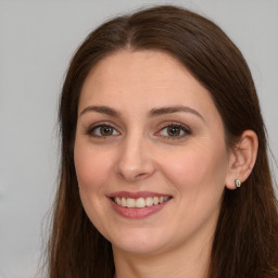 Joyful white young-adult female with long  brown hair and grey eyes