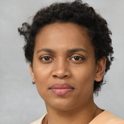 Neutral black young-adult female with short  brown hair and brown eyes