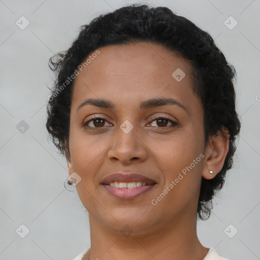 Joyful latino young-adult female with short  brown hair and brown eyes