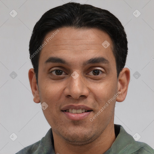 Joyful white young-adult male with short  black hair and brown eyes