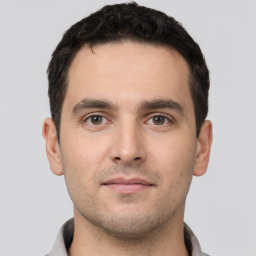 Neutral white young-adult male with short  black hair and brown eyes