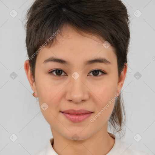 Joyful asian young-adult female with short  brown hair and brown eyes