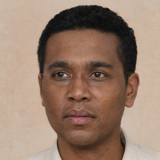 Neutral black young-adult male with short  black hair and brown eyes