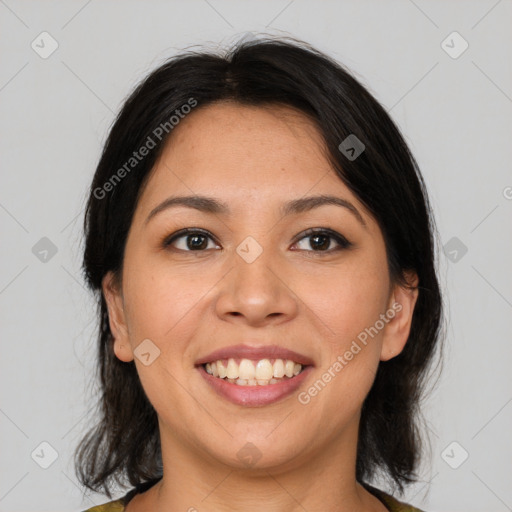 Joyful latino young-adult female with medium  brown hair and brown eyes