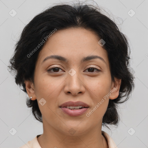 Joyful latino adult female with medium  brown hair and brown eyes