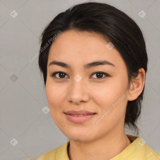 Joyful asian young-adult female with medium  brown hair and brown eyes