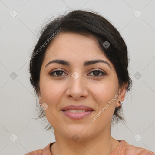 Joyful latino young-adult female with medium  brown hair and brown eyes