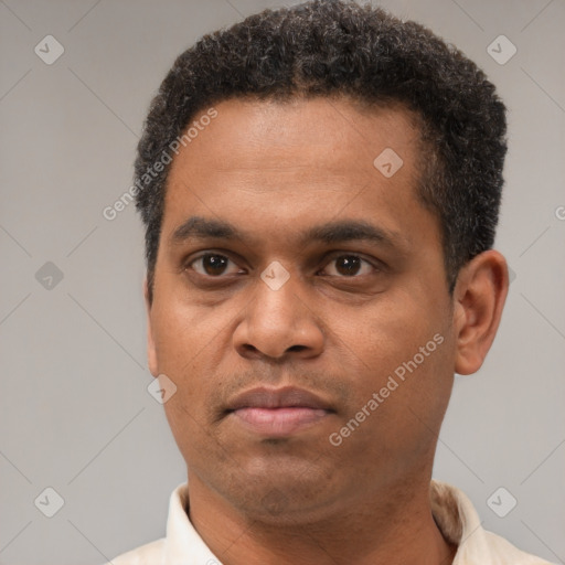 Neutral latino adult male with short  brown hair and brown eyes
