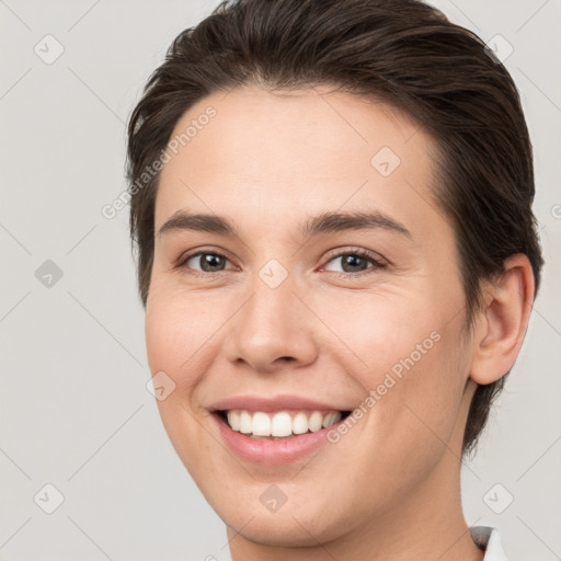 Joyful white young-adult female with medium  brown hair and brown eyes