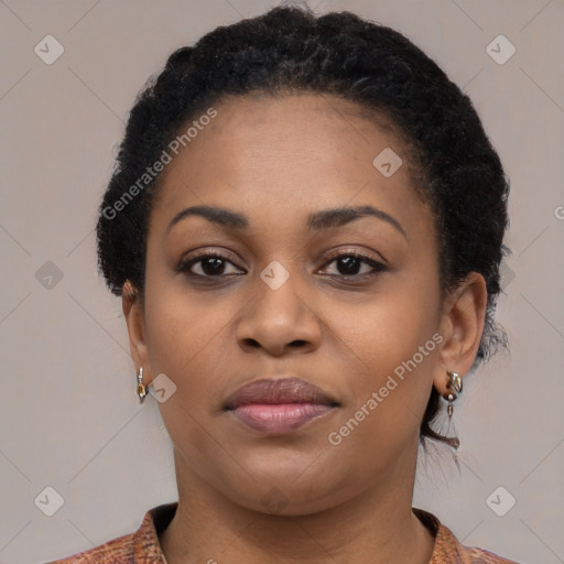 Joyful black young-adult female with medium  black hair and brown eyes