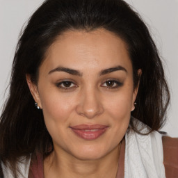 Joyful white adult female with medium  brown hair and brown eyes