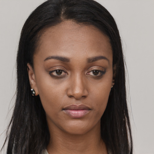 Neutral black young-adult female with long  brown hair and brown eyes
