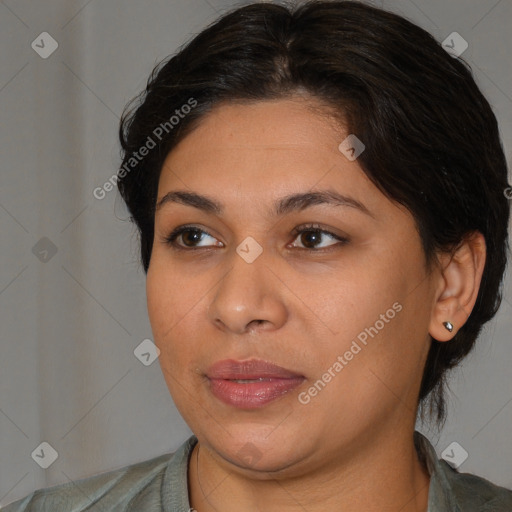 Joyful latino young-adult female with medium  brown hair and brown eyes