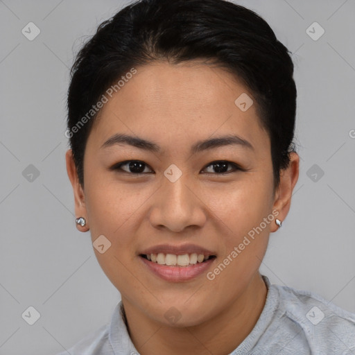 Joyful asian young-adult female with short  black hair and brown eyes