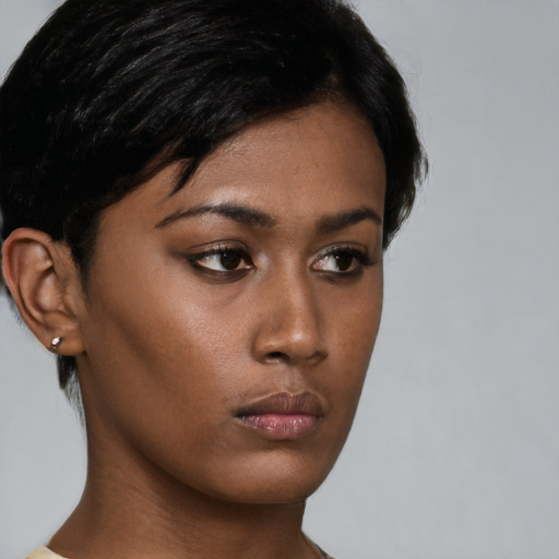 Neutral black young-adult female with short  brown hair and brown eyes