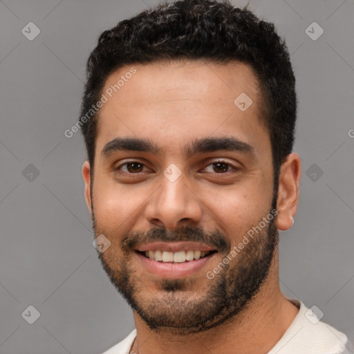 Joyful white young-adult male with short  black hair and brown eyes