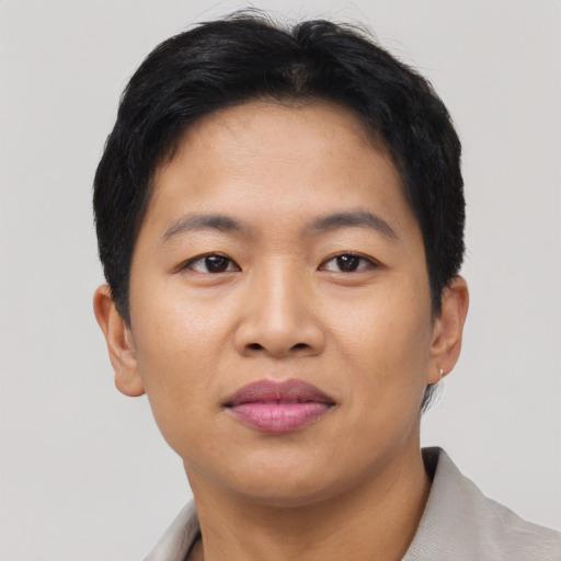 Joyful asian young-adult female with short  brown hair and brown eyes