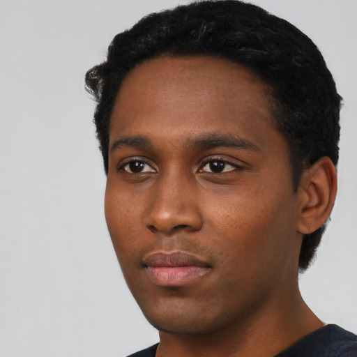 Neutral black young-adult male with short  black hair and brown eyes