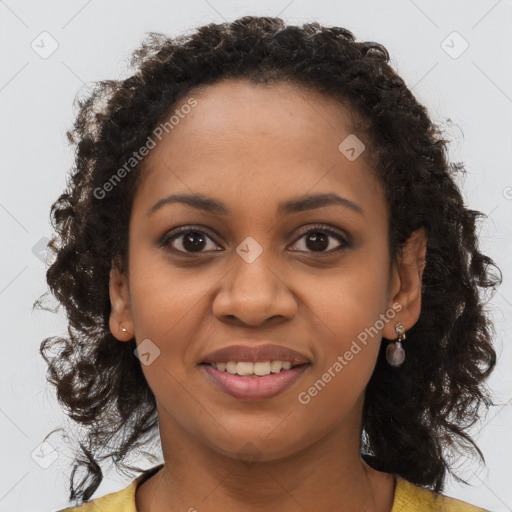 Joyful black young-adult female with long  brown hair and brown eyes