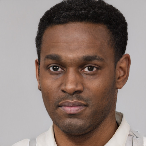 Neutral black young-adult male with short  black hair and brown eyes