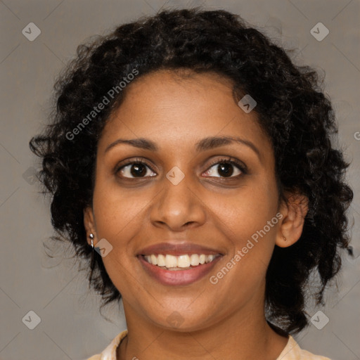 Joyful black young-adult female with medium  brown hair and brown eyes