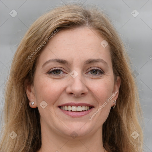 Joyful white adult female with long  brown hair and grey eyes