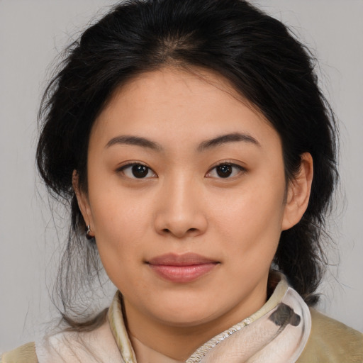 Joyful asian young-adult female with medium  brown hair and brown eyes