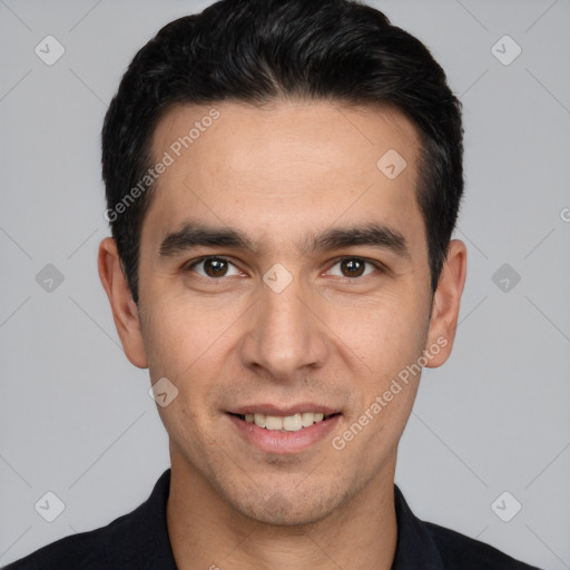 Joyful white young-adult male with short  black hair and brown eyes