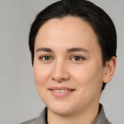 Joyful white young-adult female with medium  brown hair and brown eyes